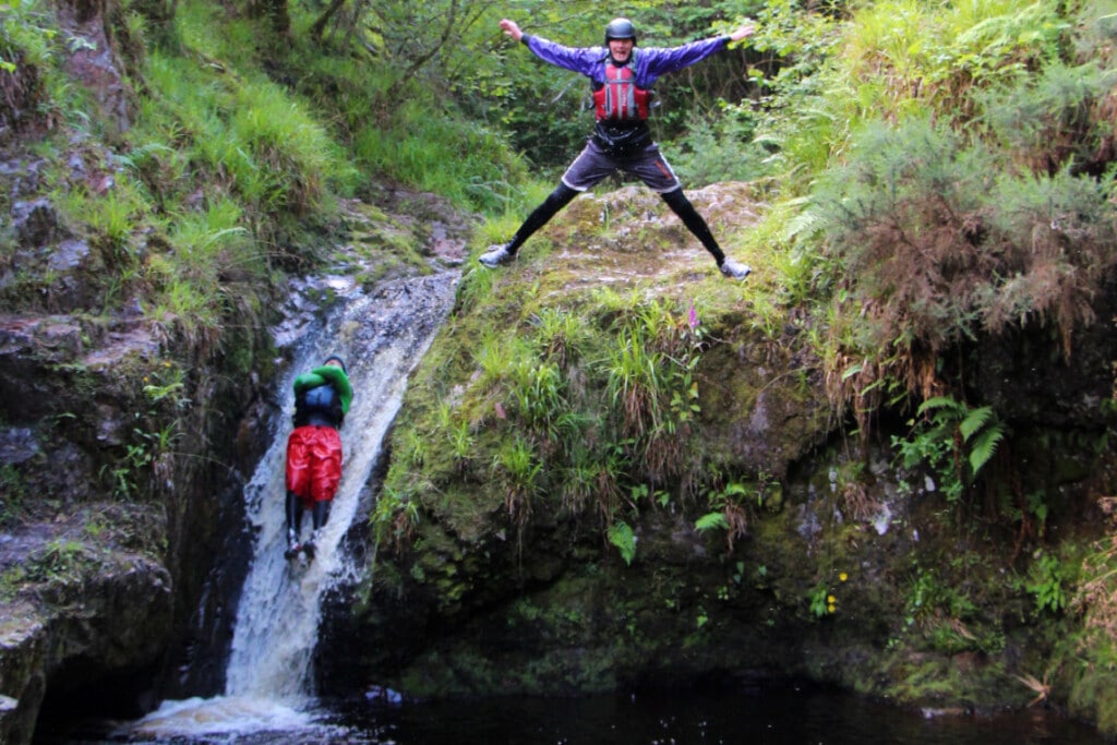 Gorge walking - Jumping and sliding off a waterfall