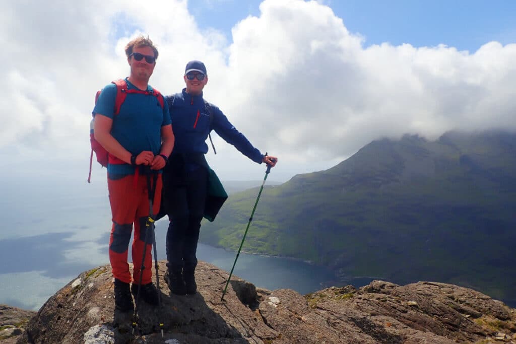 2 walkers pose for a photo at the summit of sgurr na stri, isle of skye