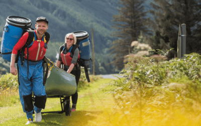 2 people portaging during a canoe expedition