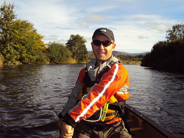 calum Out canoeing on a scottish river, smiling