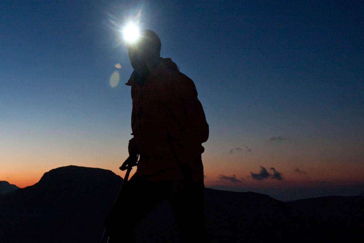 person using head torch at night