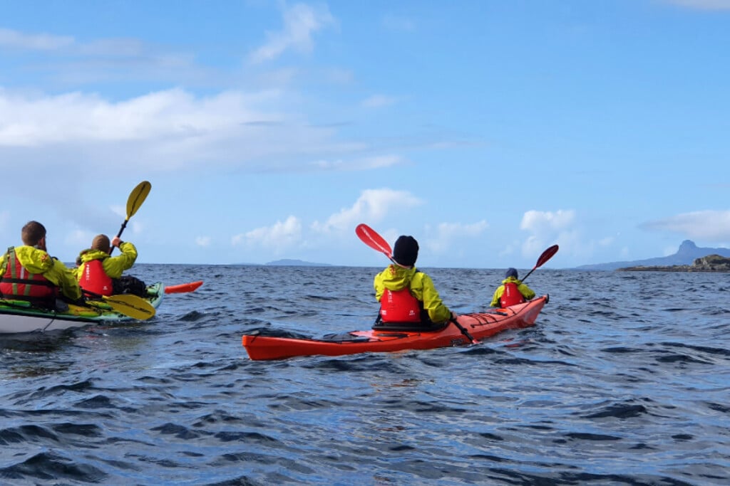 people sea kayaking west coast of scotland